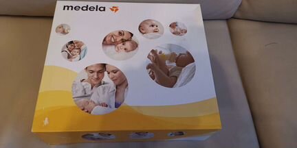 Молокоотсос Medela mini electric